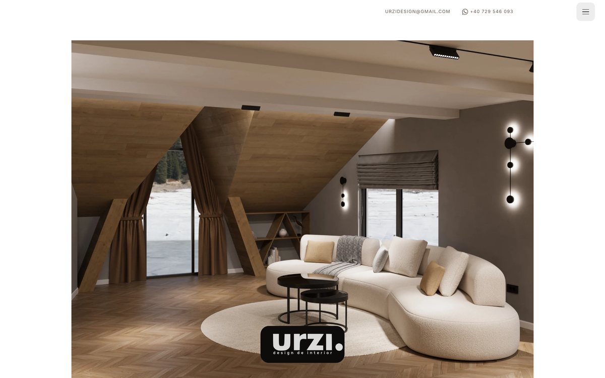The URZI Design homepage: a full-bleed interior photograph of a loft living room with the urzi wordmark over it.